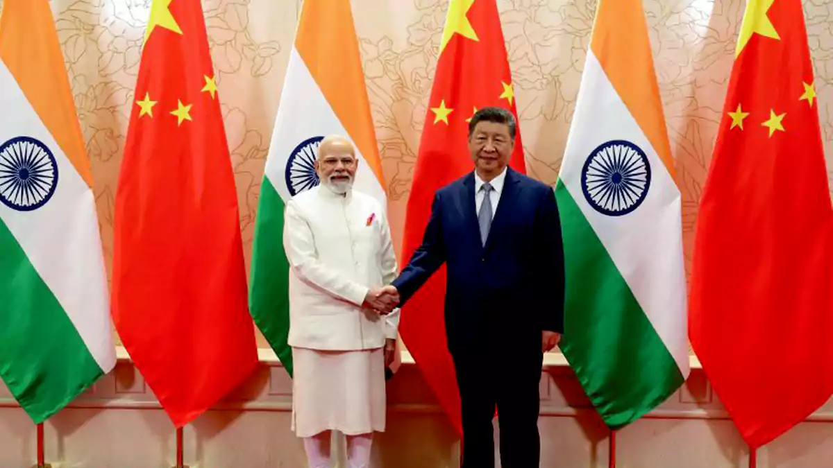Narendra Modi shakes hands with Chinese President Xi Jinping during a meeting