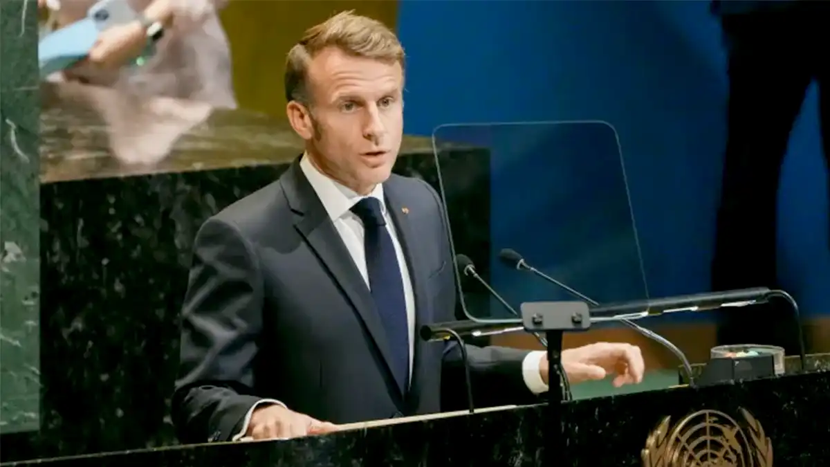 Emmanuel Macron addresses delegates during a high-level meeting